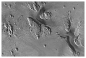 Dark Materials on Block in Olympus Mons Aureole