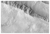 Eroded Ponded and Pitted Materials in Unnamed Crater 
