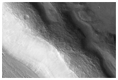 Textured Material and Weird Ejecta on Floor of Mamers Valles