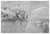 Dark Materials on the Ejecta of an Unnamed Crater on Floor of Hellas Basin