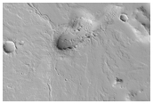 Low Shield with Radial Flows East of the Olympica Fossae