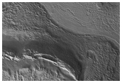 Two Overlapping Icy Flows in a Canyon of Ismeniae Fossae