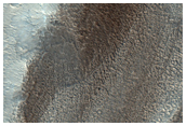 Apron/Mass Movement Material in Crater on Northwest Rim of Terby Crater