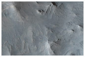 Depsitos estratificados claros y oscuros en el este de Candor Chasma