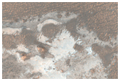 Light-Toned Outcrops in the Plains Between Melas and Candor Chasma