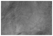 Lineated Valley Flow and Dissected Mantle Terrain in Chaotic Region