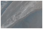 Contact Between Wallrock and Light-Toned Layering in Melas Chasma