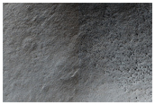Sisyphi Montes Peak: Possible Ancient Small Highlands Volcano