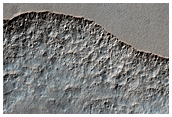 Scalloped Terrain within a Crater at Peneus Patera