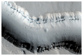 Catastrophic Outflow Features in Tharsis Region