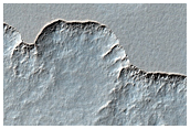 Scalloped Terrain and Exhumed Crater in Amphitrites Patera