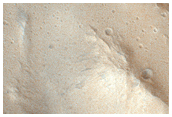 Layered Materials and Blocks in Olympus Mons Aureole