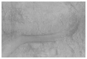 Channel Feeding Into/Out of Crater Near Nili Fossae/Isidis Planitia