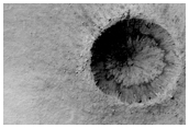 Small Relatively Fresh Crater with Dark Rays