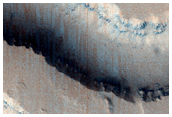 Catastrophic Outflow Features in Tharsis Region