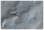 Exposure of Polar Layered Deposits Not Observed by Mars Global Surveyor