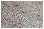Layered Deposits Within Impact Crater in Noachis Terra