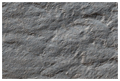 Possible Exposures of Polar Layered Deposits in Area Not Well Observed