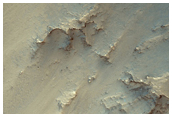 Crater Cut by Coprates Chasma