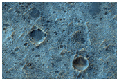 Shallowed Crater on Plains in the Melas Dorsa Region