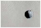 Pair of Small Pits in the Arsia Chasmata