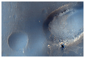 Sirenum Fossae Crater