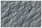Possible Exposures of Polar Layered Deposits in Area Not Well Observed