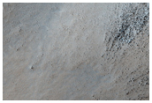Peak of Possible Remnant Highlands Volcano in Sisyphi Planum