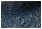 Circular Feature Surrounding Mesa South of Tharsis Region