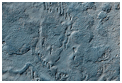 Transition between Ridged Putative Eskers and Smooth Polar Terrain