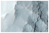 Layering along Oudemans Crater Wall