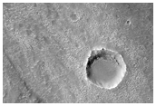 Recent Sharp Streamlined Features and Channels Over Broad Region