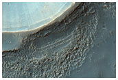 Layered Dissected Mantle Terrain and Channel Breaching Crater Rim