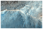 A Crater Superposed on Chaotic Terrain Near the Head of a Dao Vallis Branch