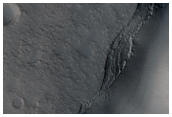 Dark Outcrops in Valley Regions Seen in MOC Image M07-02960