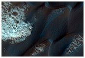 Crater and Plains Deposit Northwest of Herschel Crater
