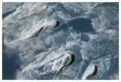 High Albedo Materials in Ganges Chasma