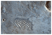 Small Bright-Ejecta Crater Clusters West of Zunil Crater