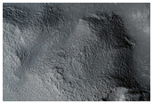 Valley Breaches Crater and Ends in Frontal Scarp