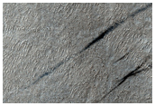 Complex Enigmatic Landscape Deep in Hellas Basin