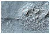 Cluster of Rounded Hills North of Reull Vallis