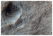 Crater with Inlet and Outlet Channel of Hellas Basin Floor