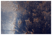 Sharp Albedo Boundary and Blunt Valley Headwall in Syria Planum