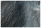 Deeply-Incised Channels in Mantled Crater Walls