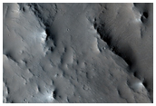 Ejecta Flow Around Topographic Obstacle in East Elysium Planitia