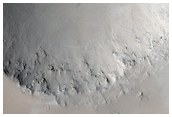 Sharp-Rimmed 5-Kilometer Diameter Crater in Central Tharsis Region