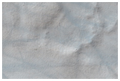 Gullies in Western Wall and Bedrock Layers