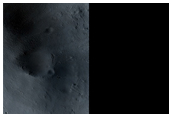 New Dark Spot and Impact Crater