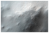 Gullies Associated with Overhanging Layer