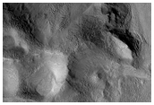 Lineated Valley Flow and Dissected Mantle Terrain in Chaotic Region